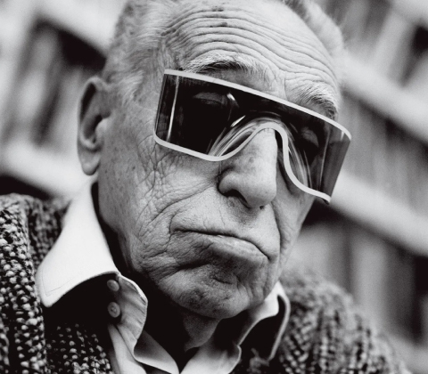 An off-kilter portrait of Achille Castiglioni with sunglasses