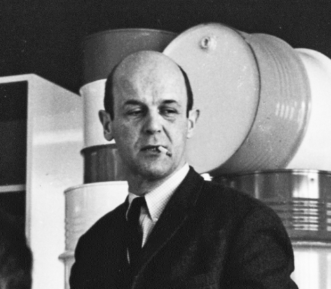 A portrait of Martin Visser smoking a cigarette