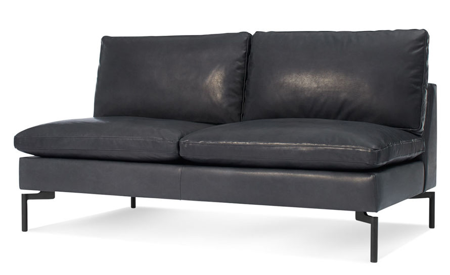 armless tufted leather sofa